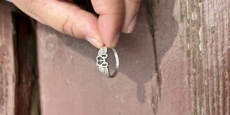 Maria holding up her ring