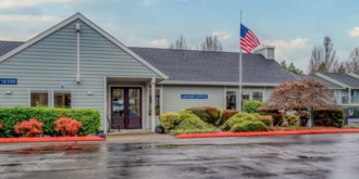 An exterior overall view of Woodspring Apartments