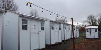 An overall frontal external view of several shelter pods