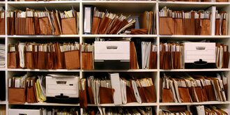 An archive of paper document in file folders