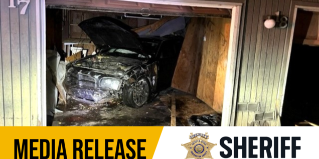 photo of crashed car inside garage building