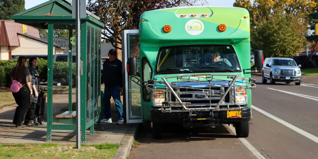 People boarding GroveLink community connector shuttle