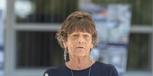 A shot of Melanie speaking at the Housing Preservation Celebration event