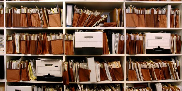 An archive of paper document in file folders