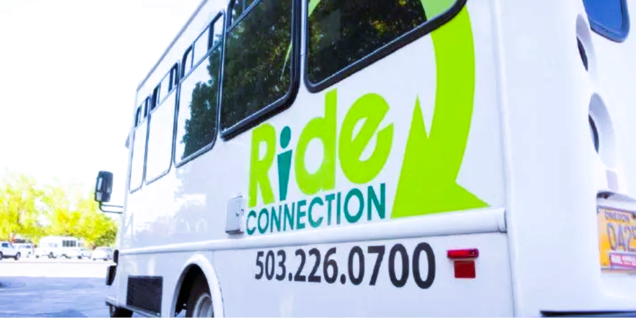 Shuttle bus with Ride Connection and 503-226-0700 on the side