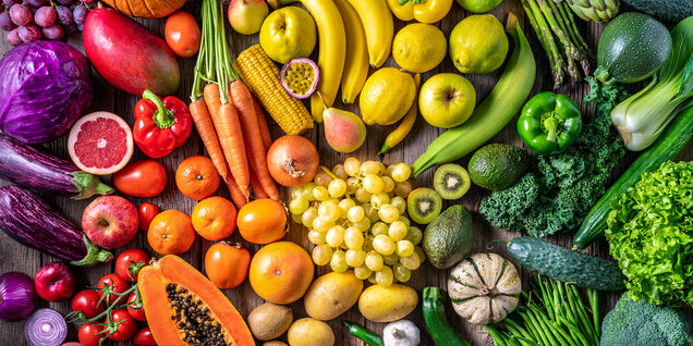 assorted fruits and vegetables arranged by colors in the spectrum