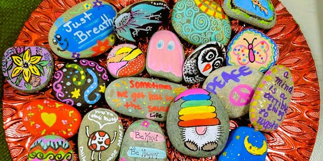 plate of colorfully painted rocks