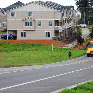 Kaiser Road bus headed north with pedestrian walking no road shoulder