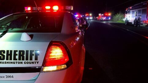 back of sheriff's car at night