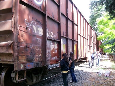 supervised work crew near train car