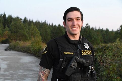 smiling deputy outside