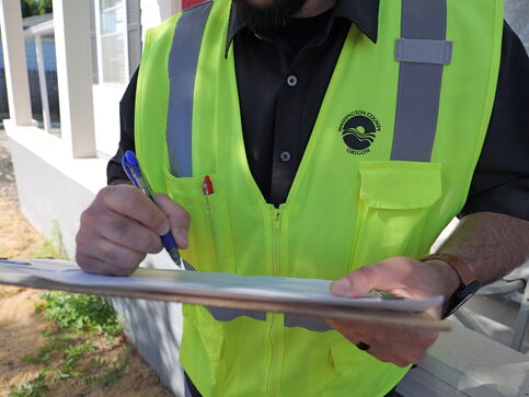 Yellow vest with Washington County Logo in black on right top corner of vest