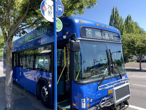 TriMet 76 bus at a stop with its door open waiting for passengers. Image Credit: TriMet