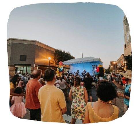 People viewing an outdoor concert
