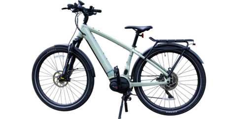 A light green Class 3 electric bike with a rear cargo rack, front suspension, and black tires, shown from the side