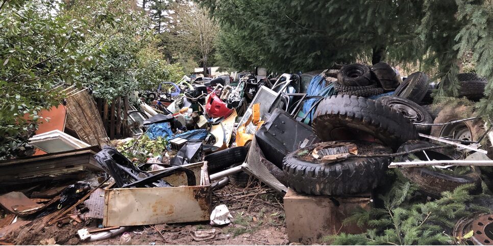 Tires and other garbage littering a property